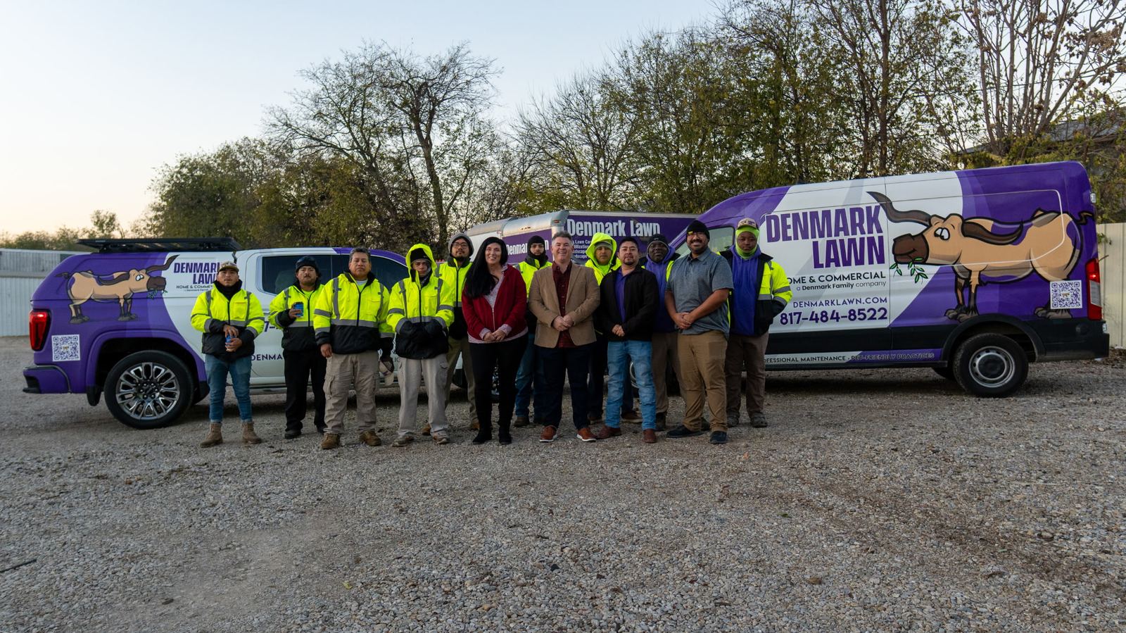 Denmark Lawn crew lined up with branded trucks — White Settlement / Fort Worth