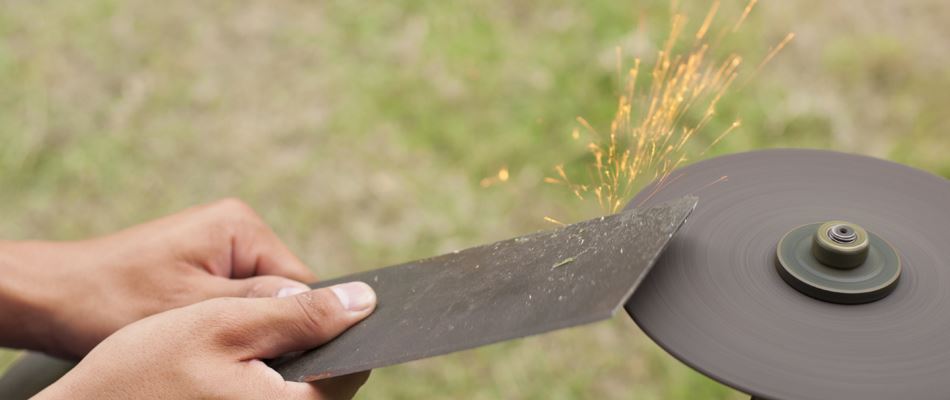 Blade being sharpened for a lawn mower in Benbrook, TX.